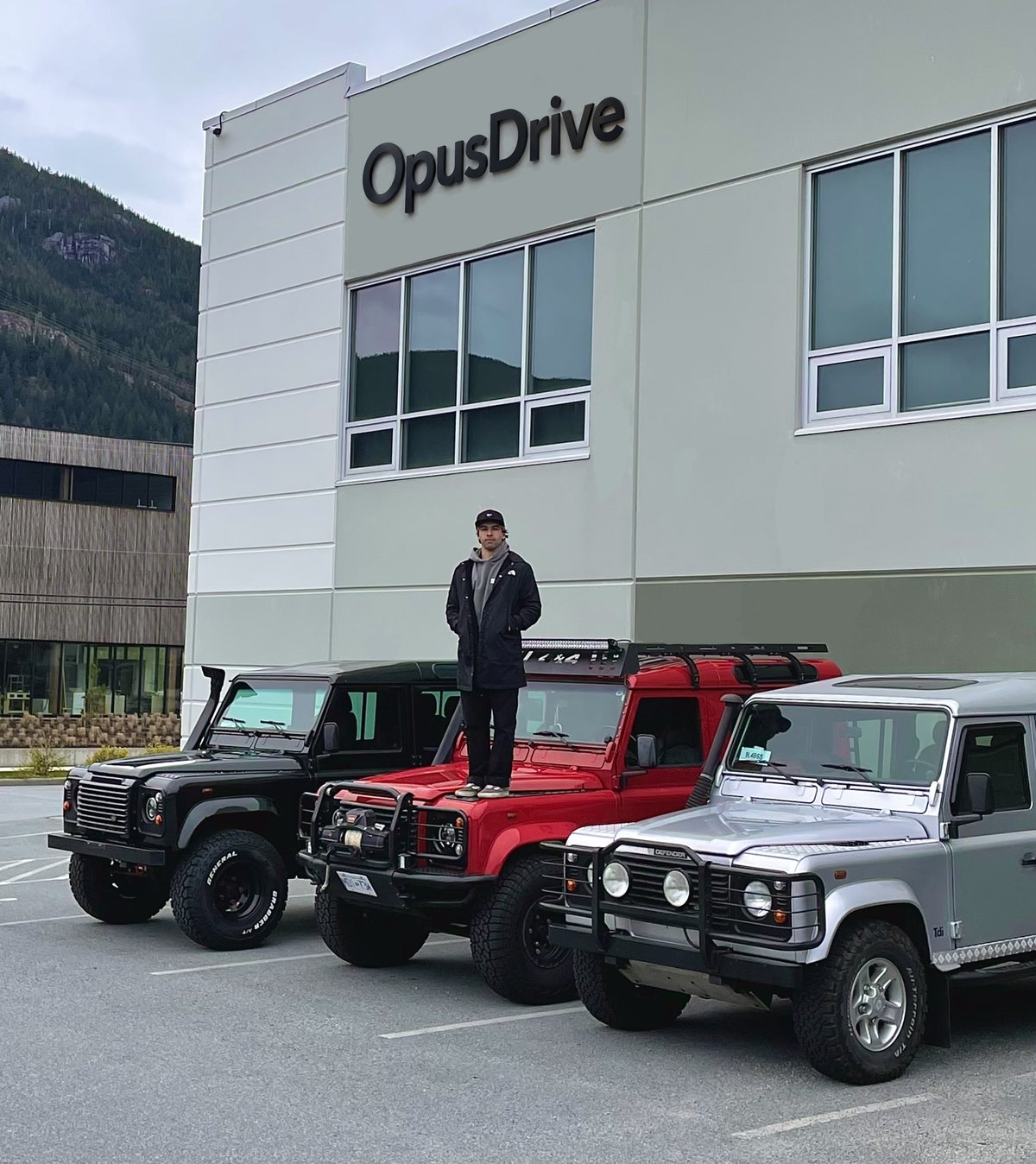 Nick Moraes at OpusDrive with three Land Rover Defenders